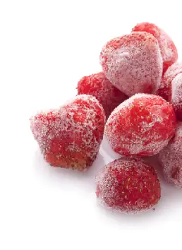 Fresh frozen strawberries and berries used for live ice cream blending